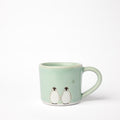 Petite tasse double pingouin et lune céladon